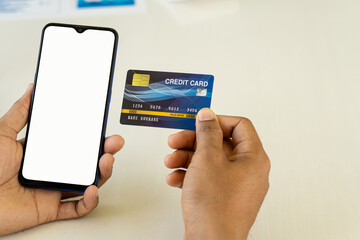 Concept image of credit card and cell phone with blank screen concept. Online payments and financial transactions