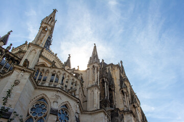 Close up exterior view of the ornate medieval Our Lady of Reims Cathedral (Notre-Dame de Reims) in France, with high Gothic architecture, showing a view of its apse