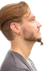 Obraz premium A profile portrait of a stylish man with a piercing
