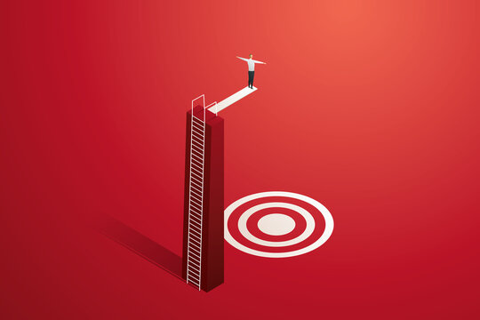 Businessman getting ready to jump onto a target on a springboard.
