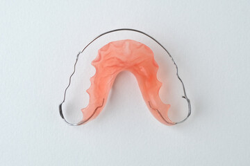 Orthodontic retainer on white background