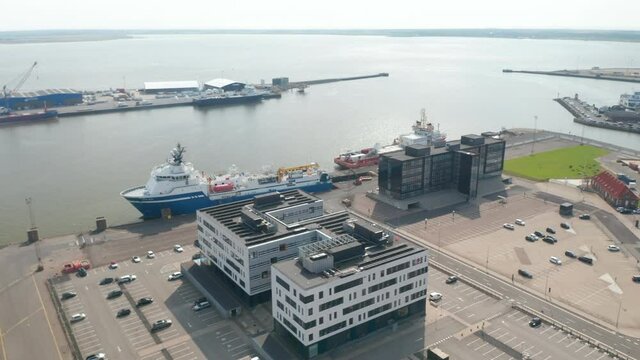 Aerial view of Esbjerg harbor, one of the largest harbour of the North Sea. High angle view of the cargo ship waiting at the dock for export and import business and logistics