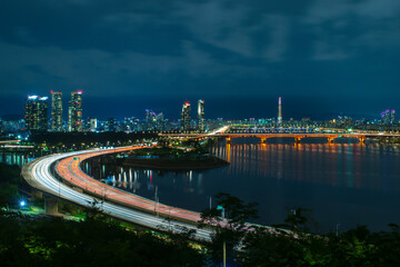 Beautiful Night view of Seoul with heavy traffic along with bridge of Han river in South Korea