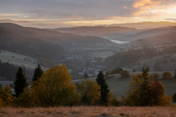 Fototapeta na wymiar mountain village in the autumn scenery at sunrise