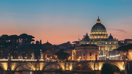 Fototapeta na wymiar Vatican, Italy. Papal Basilica Of St. Peter In The Vatican And Aelian Bridge In Evening Night Illuminations. Day To NIght Time Lapse. Sunset Time