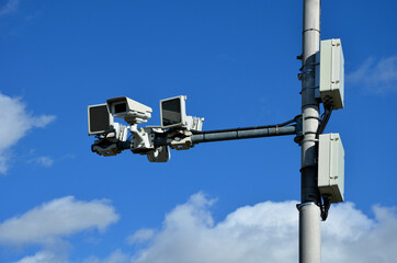 a camera system monitoring the speed of traffic vehicles on the city motorway ring. the fine comes...