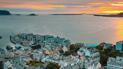 Obraz premium Alesund, Norway. Amazing Natural Bright Dramatic Sky In Warm Colours Above Alesund Valderoya And Islands In Sunset Time. Colorful Sky Background. Beauty In Norwegian Nature. 4K