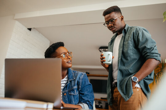 Freelance work concept. Black couple working from home
