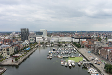 Antwerp, Belgium, a body of water with a city in the background, harbor