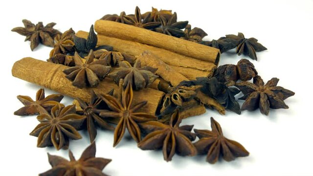 Aromatic spices star anise and Dal Chini - Indian kitchen. Exotic spices star anise and cinnamon on a turntable - cooking ingredients  condiments