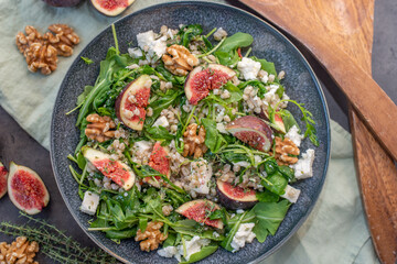healthy barley salad with fresh figs, feta cheese and walnuts
