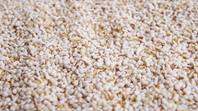 Amaranth popped, high protein puffy grain cereal ingredient. Pseudocereal food, gluten free. Macro. Rotation