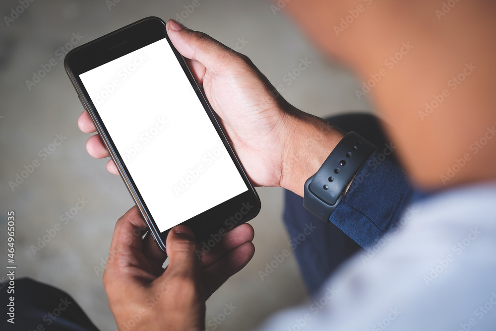 Poster close up view man holding smart phone with empty display.