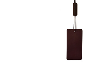 Empty brown tag hanging on a white background