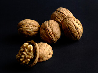 walnuts (akhrot) on black background, Dry fruits, walnut or akhrot well known dried fruit having shape like brain.