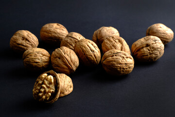walnuts (akhrot) on black background, Dry fruits, walnut or akhrot well known dried fruit having shape like brain.