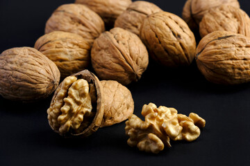 walnuts (akhrot) on black background, Dry fruits, walnut or akhrot well known dried fruit having shape like brain.
