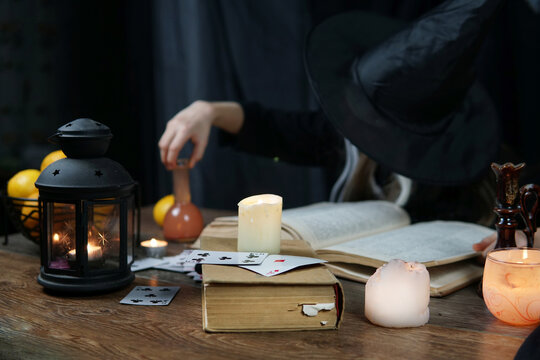 Girl Aged 9 Years In Witch Costumes In An Old House On Halloween Brew A Magic Potion And Conjure