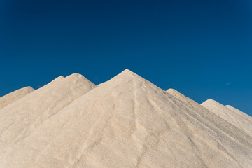 Mountains of salt in a salt factory at sunset on a sunny day. Mallorca island, Spain
