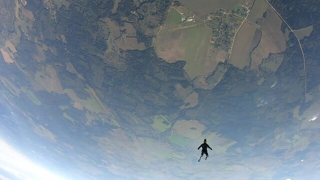 Skydiving. Skydiver is flying in the sky. Slow motion.