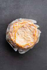 French cheese Langres on dark background