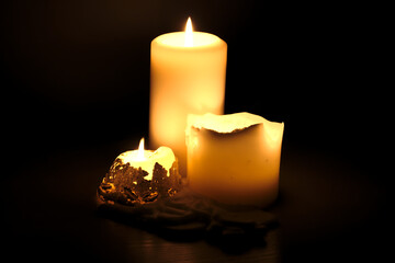 Burning candles in the dark.