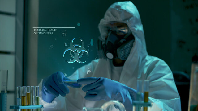 Bio engineer use virtual futuristic computer with transparent biohazard hologram - Powered by Adobe