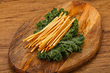 Chechel cheese sticks over board