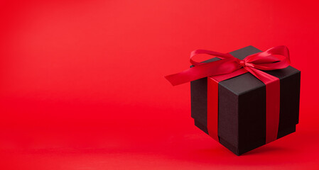 Gift box with red ribbon