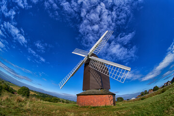 Windmill taken through fish eye lens with blue sky 