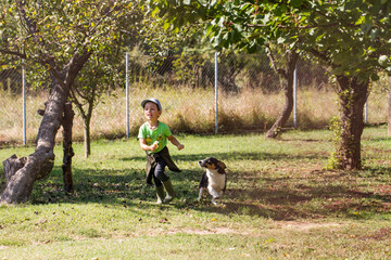 Boy running with dog
