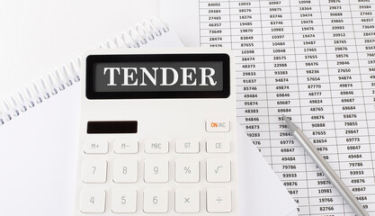 Calculator with text TENDER on the notebook . Business, finance conceptual.