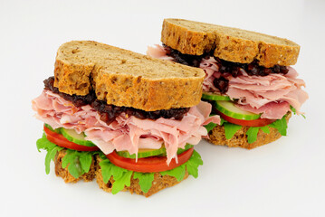 Ham and salad sandwiches In crusty brown bread slices with pickle relish