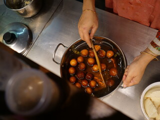 indian sweets boiling in sweet syrup