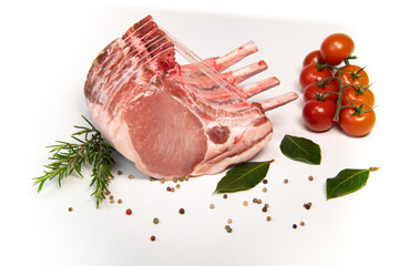 Pork ribs, Pork ribs with raw bone, Entrecote, Fresh and raw meats. Organic food, Meat with spices: pepper, salt, bay leaf, rosemary and its vegetables. High quality photo