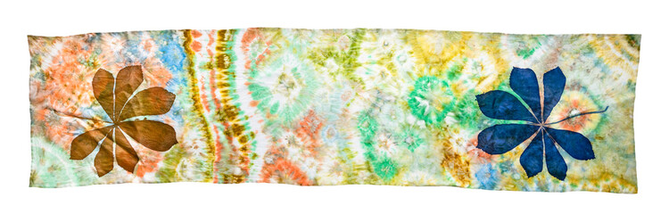 handcrafted silk scarf hand-drawn with silhouette of chestnut leaf and abstract pattern in Tie-dye batik technique isolated on white background