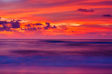 Seascape view of a tropical beach during sunset.