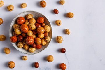 Senbei japanese snack. Senbei traditional Japanese snack in a bowl close-up. Rice crackers with nori, peanuts with sesame seeds, and other snacks. Mix traditional Japanese snack food.