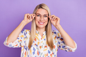 Photo of shiny sweet mature lady dressed print blouse glasses smiling isolated purple color background