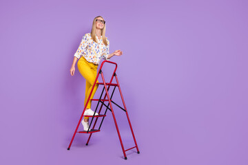 Photo of purposeful smart young woman wear print shirt spectacles smiling rising ladder looking empy space isolated violet color background