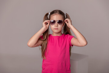 beautiful girl in sunglasses. advertising children's glasses