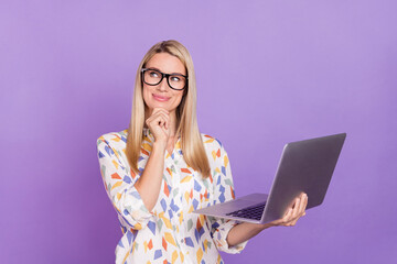 Photo of smart dreamy young woman wear print shirt spectacles smiling arm chin holding modern...