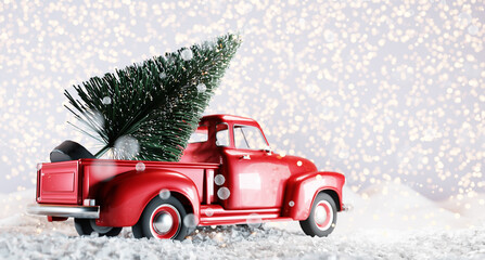 Christmas tree on red toy car trunk