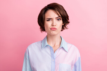 Fototapeta premium Photo portrait woman unhappy dissatisfied unsure doubtful isolated pastel pink color background