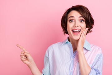 Photo of young excited woman happy positive smile indicate finger empty space ad advise select...