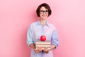 Photo of young woman happy positive smile education books materials apple isolated over pastel color background