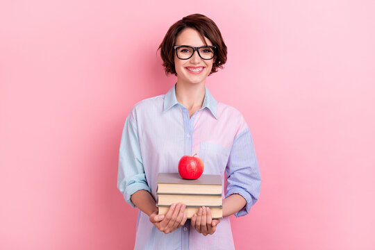 Photo of young woman happy positive smile education books materials apple isolated over pastel color background - Powered by Adobe