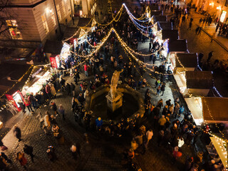 Lviv, Ukraine - January 3, 2021: aerial view of christmas city center with crowd of people