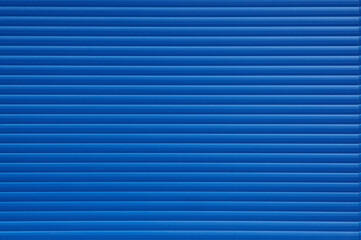 Textured background of blue wall with lines