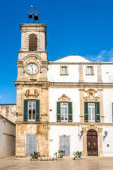 Vie wat the Clock tower in the streets of Martina Franca town - Italy - obrazy, fototapety, plakaty